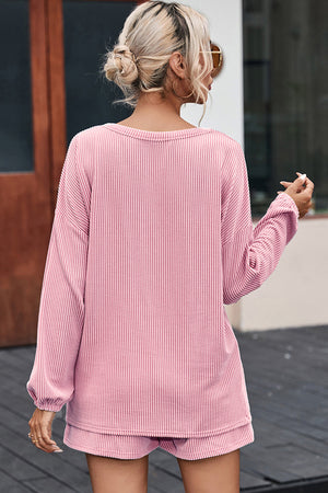 Blush pink ribbed knit outfit set with long sleeves and shorts, casual chic style.