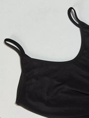 Black maxi dress with spaghetti straps and a scoop neckline.