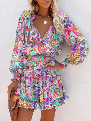Abstract paisley print tiered mini dress with ruffles and long sleeves.