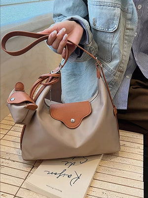 Elevated canvas hobo bag in Khaki with brown trim and coin purse.