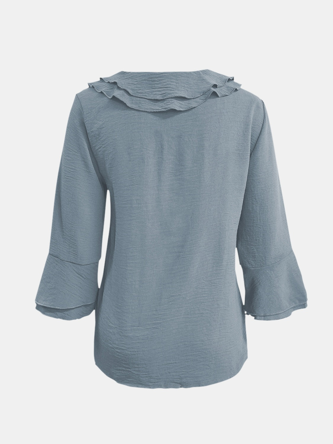 Light blue linen blouse with ruffled neckline and flared sleeves.