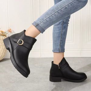 Black ankle boots with a side buckle detail and block heel.