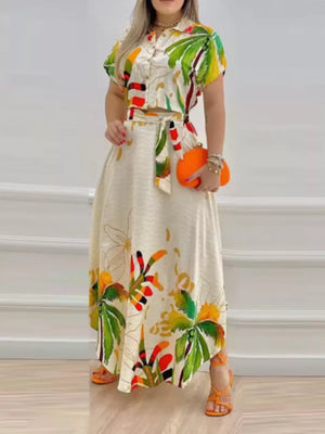 Tropical print crop top and A-line skirt set with button front and tie waist.