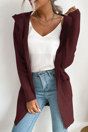 Burgundy ribbed knit hooded cardigan with drape front and pockets.