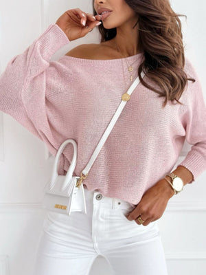 Blush pink knit sweater with off-shoulder neckline and batwing sleeves.