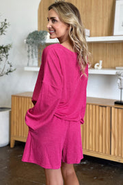 Waffle knit lounge set in hot pink with blouson sleeves and shorts.