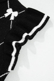 Black knit vest with white diamond bow pattern and striped trim