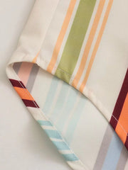 Prismatic stripe band collar blouse with multicolor stripes and buttoned detail.