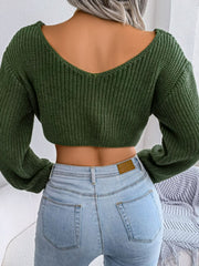 Olive knit cropped sweater with V-neck and long sleeves, acrylic fabric.