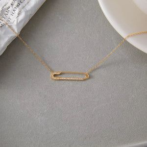Gold paperclip necklace with pave crystal detail on a delicate chain.