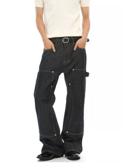 Dark wash cotton blend carpenter jeans with contrast stitching and distinctive pockets.