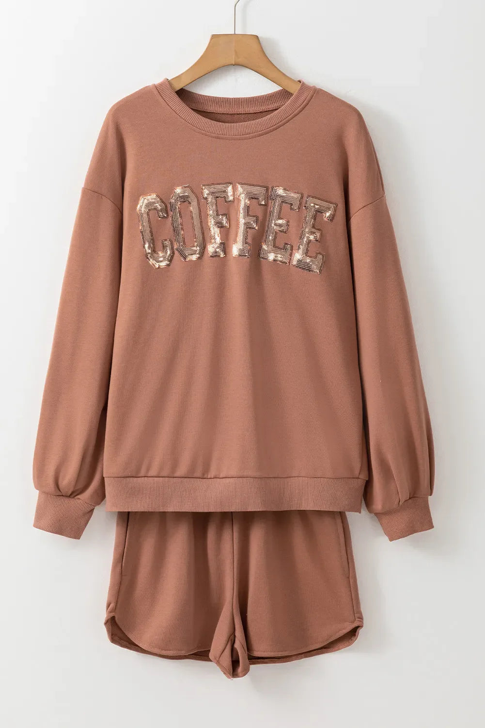 Taupe loungewear set with sequin COFFEE graphic on sweatshirt and matching shorts.