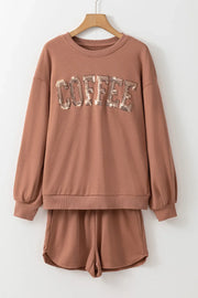 Taupe loungewear set with sequin COFFEE graphic on sweatshirt and matching shorts.