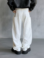 White textured cotton wide-leg jeans with large front pockets and curved seams.