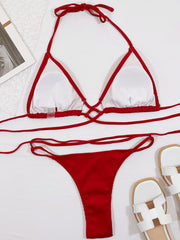 Burgundy ribbed halter bikini set with crisscross detail and thong bottoms.