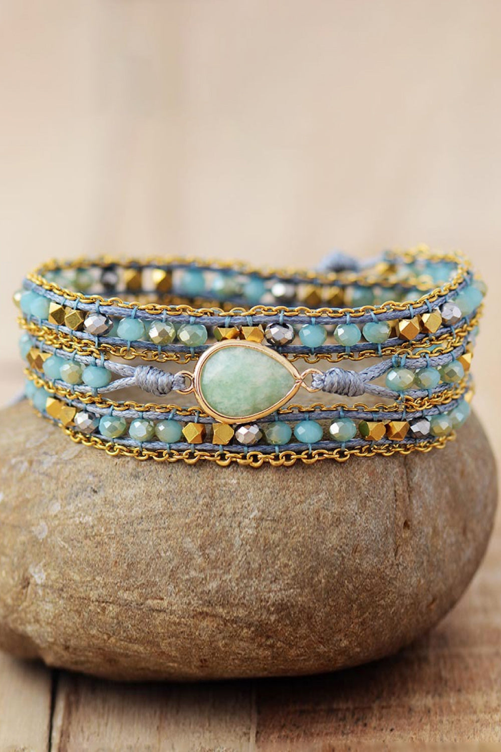 Aqua beaded wrap bracelet with gold chain and teardrop gemstone accent