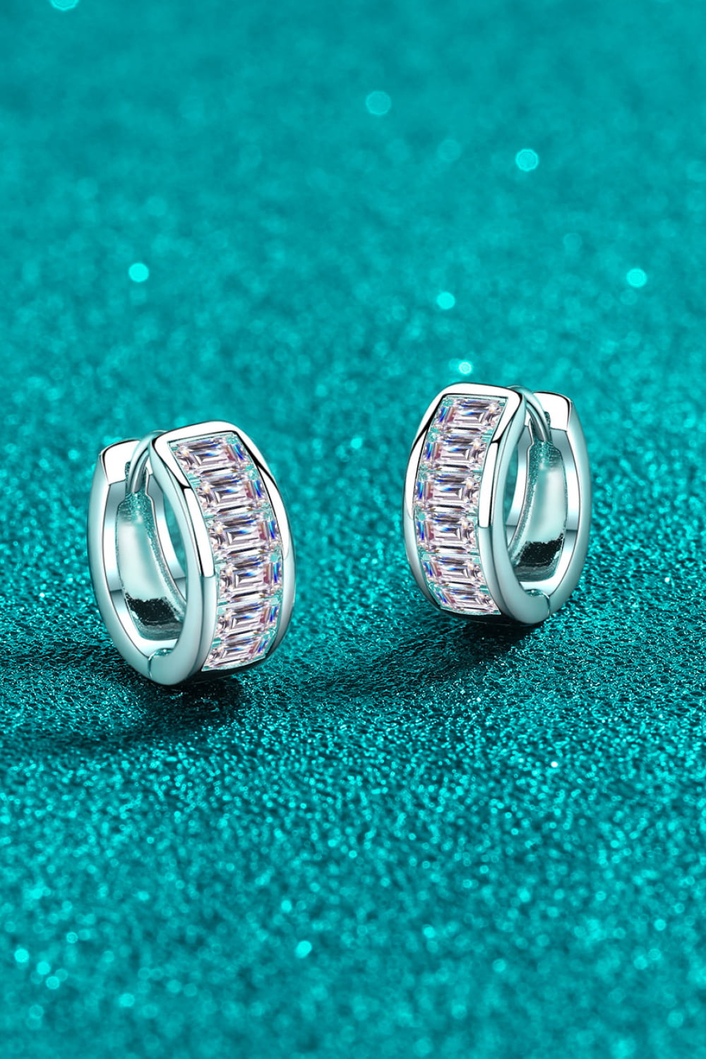 Silver baguette cut crystal huggie hoops with sparkling details.