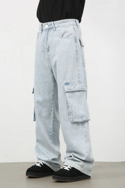 Oversized light wash denim cargo pants with multiple pockets.
