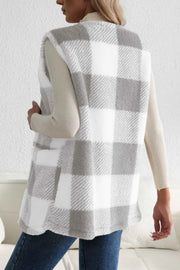 Oversized sherpa gilet in light gray buffalo check with pockets.