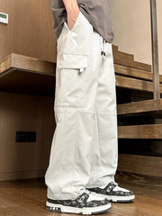 White oversized cargo pants with adjustable drawstring and multiple pockets.