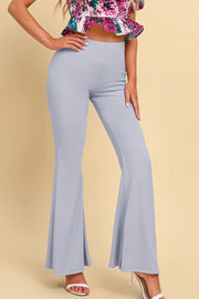 Light gray sculpted flare leggings with a high waist, worn with a floral crop top.