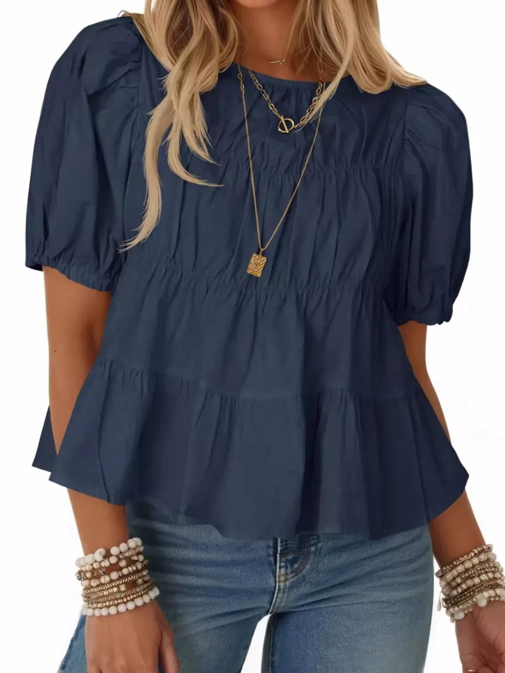 Dark blue maternity blouse with puff sleeves, ruffled tiers, and smocked bodice.