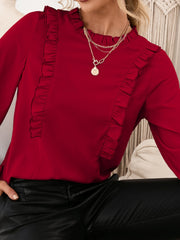 Burgundy ruffled yoke blouson sleeve top with mock neck.