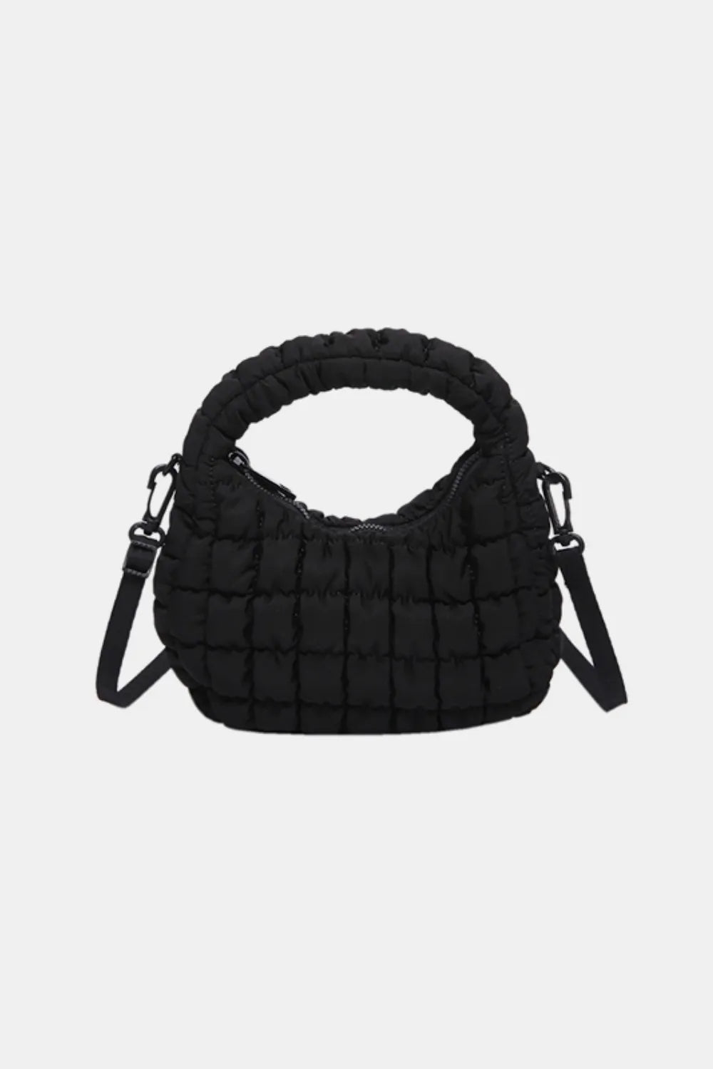 Black padded crescent crossbody bag with sculptural texture and top handle.