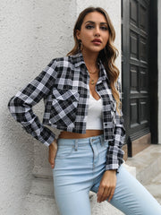 Cropped black plaid shirt jacket with buttoned pockets and collar.