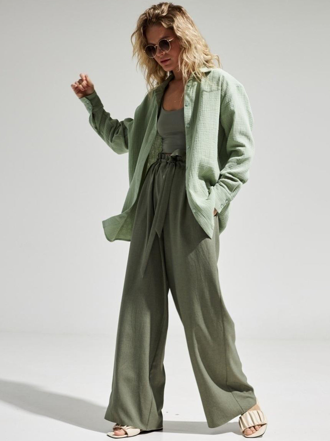 Light green textured cotton overshirt with relaxed fit, open collar, and button cuffs.