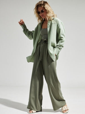 Light green textured cotton overshirt with relaxed fit, open collar, and button cuffs.