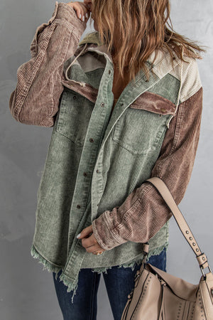 Colorblock corduroy hooded utility jacket in green and tan with frayed hem and distressed details.