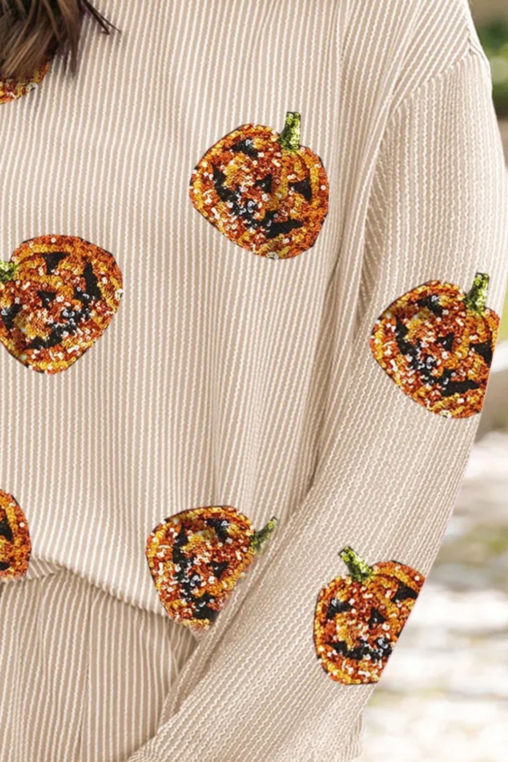 Tan striped loungewear top with sequin pumpkin details