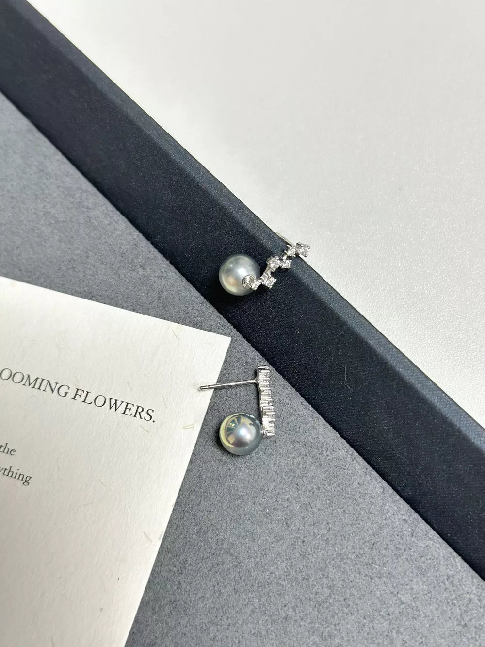 Elegant gray pearl and zircon drop earrings in sterling silver.