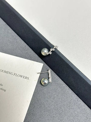 Elegant gray pearl and zircon drop earrings in sterling silver.