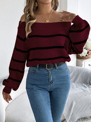 Burgundy off-the-shoulder striped knit pullover sweater with long sleeves.