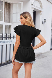 Black flutter sleeve peplum blouse with ruffled hem and subtle dot pattern