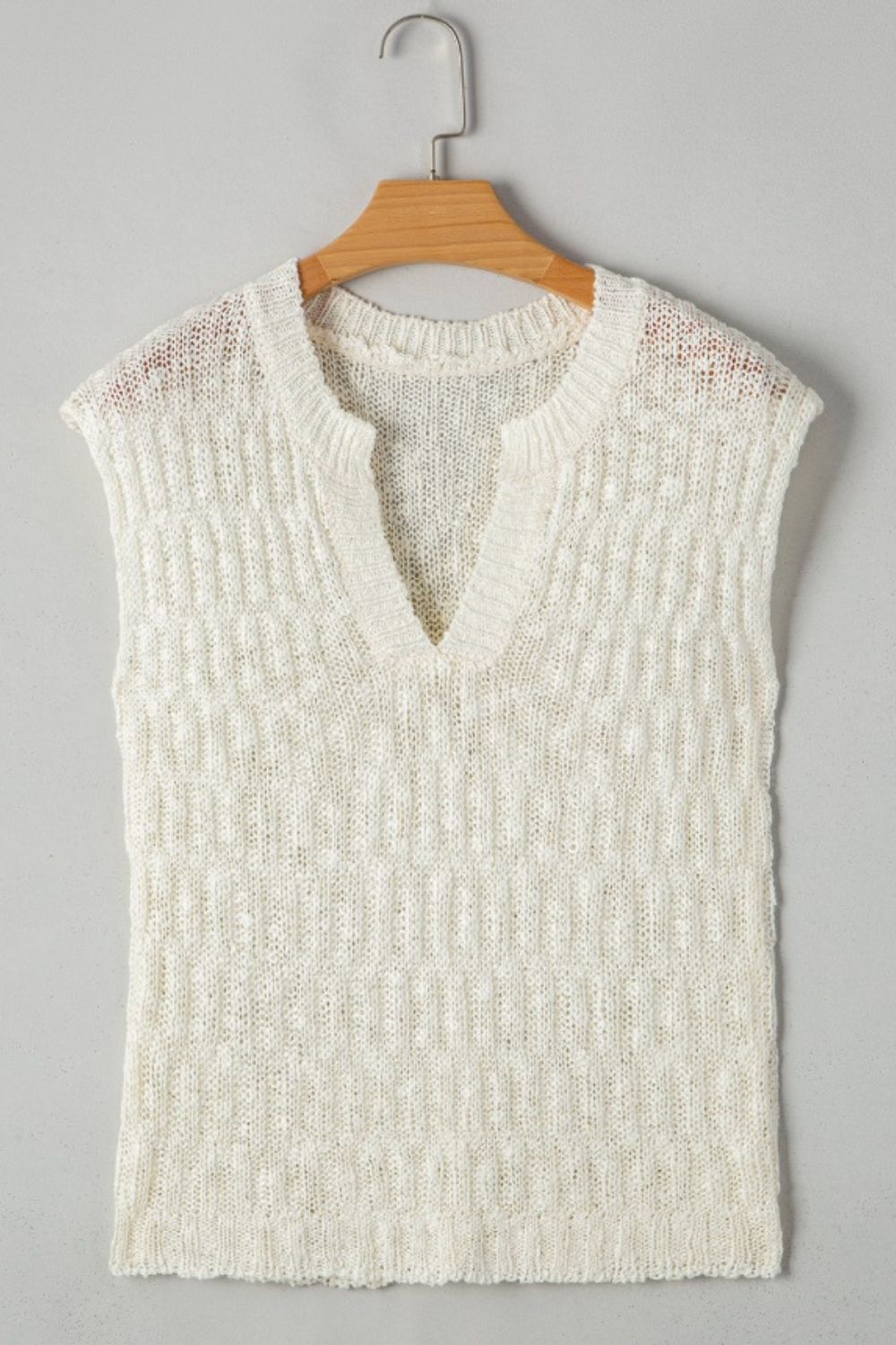 Textured knit V-neck shell top in beige with a relaxed fit.