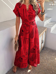 Scarlet geometric print wide-leg jumpsuit with V-neck and short sleeves.