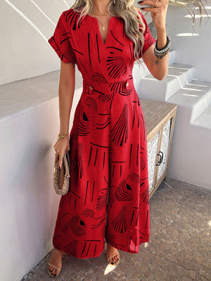Scarlet geometric print wide-leg jumpsuit with V-neck and short sleeves.