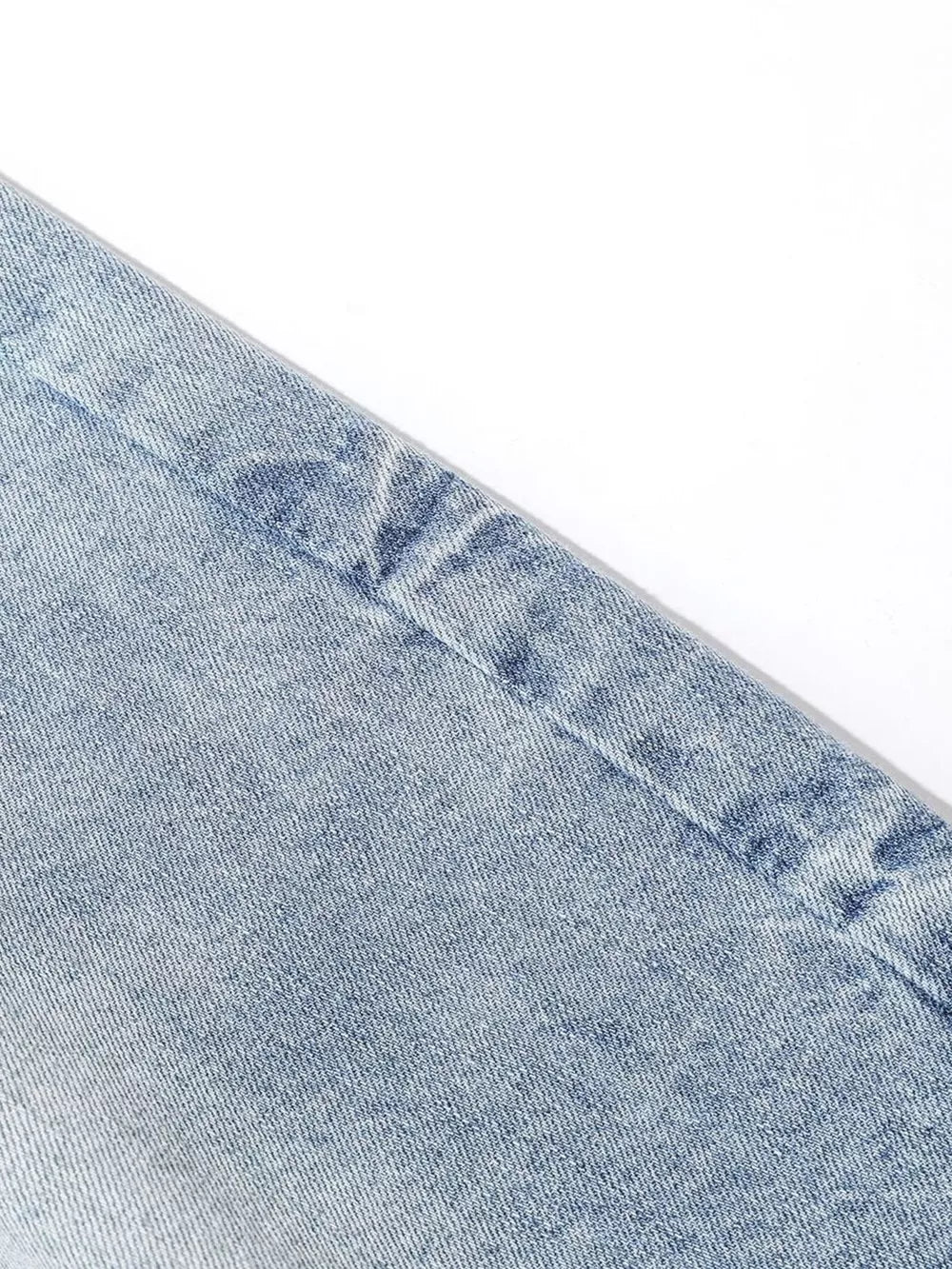 Light blue denim capris for men, relaxed fit, cotton fabric detail.