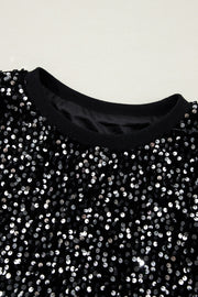 Black sequin embellished sweatshirt with ribbed cuffs and neckline.