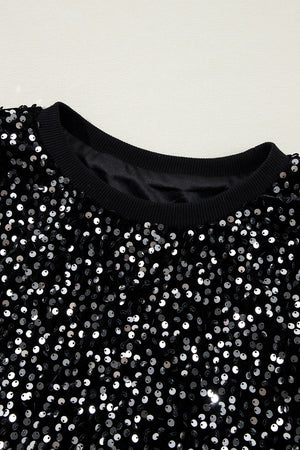 Black sequin embellished sweatshirt with ribbed cuffs and neckline.