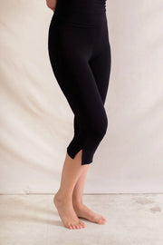 Black cropped leggings with flared hem detail