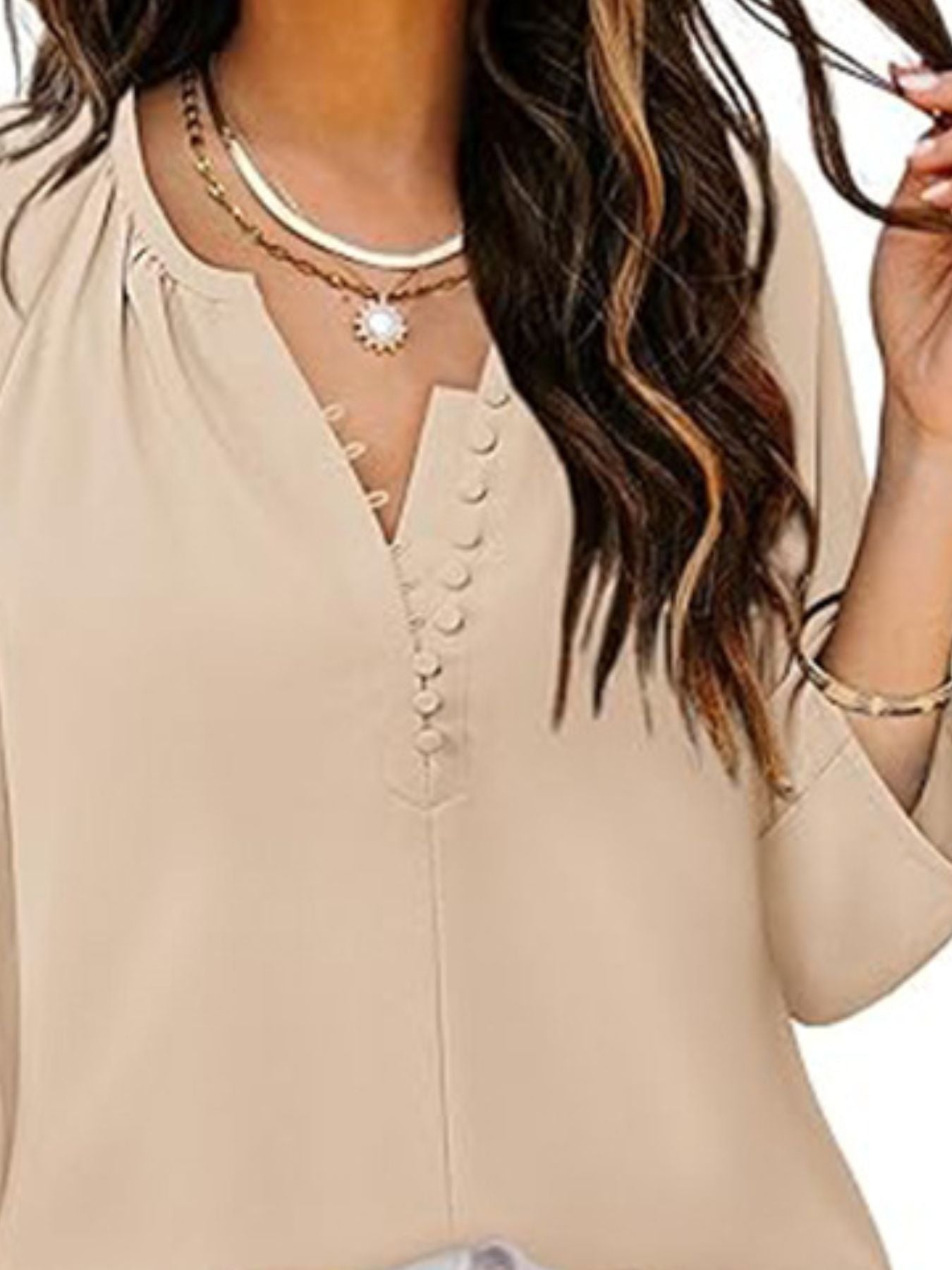 Tan V-neck blouse with 3/4 sleeves and button detail