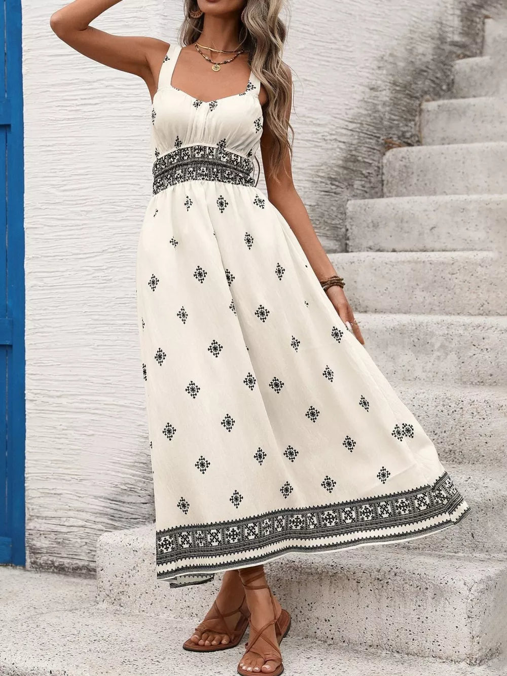 Geometric print midi dress with wide straps, smocked waist, and a-line skirt.