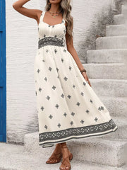 Geometric print midi dress with wide straps, smocked waist, and a-line skirt.