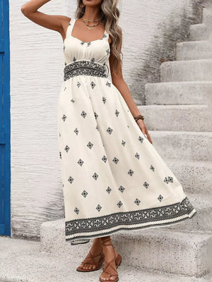 Geometric print midi dress with wide straps, smocked waist, and a-line skirt.