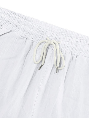 White cargo sweatpants with drawstring waist and metal-tipped cords.