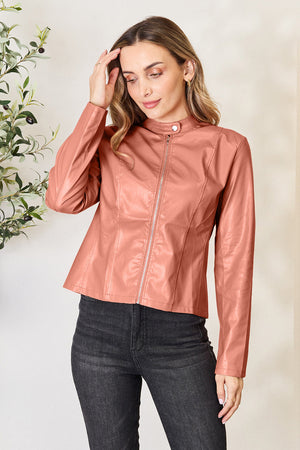 Faux leather biker jacket in Burnt Coral with a stand collar and silver zipper.